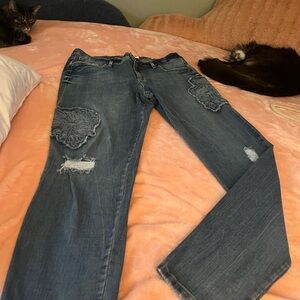 Jessica Simpson jeans with 2 flowers